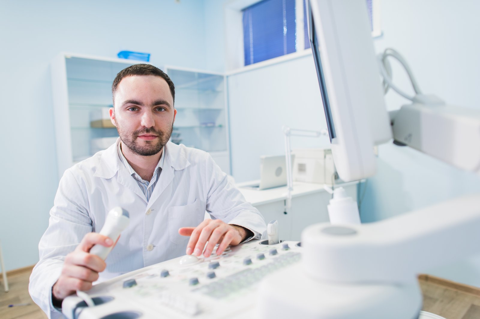 an-handsome-doctor-using-an-ultrasound-machine-imago-med